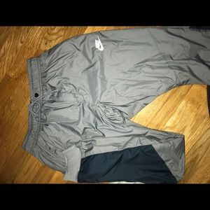 gray and blue nike windrunner pants